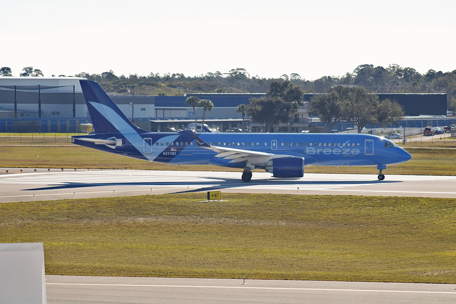 A Breeze Airways Airbus A220-300 taxis at Daytona Beach International Airport in Florida.
