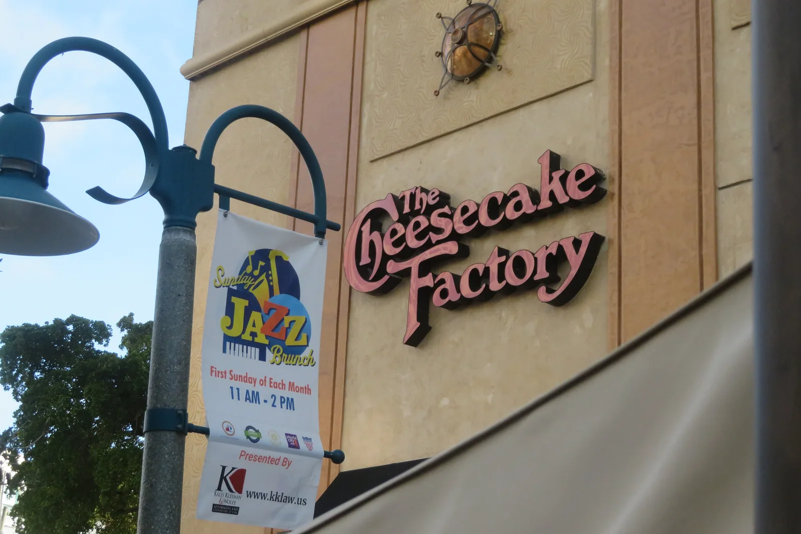 A banner for the Sunday Jazz Brunch on a lamppost along the Riverwalk in downtown Fort Lauderdale.