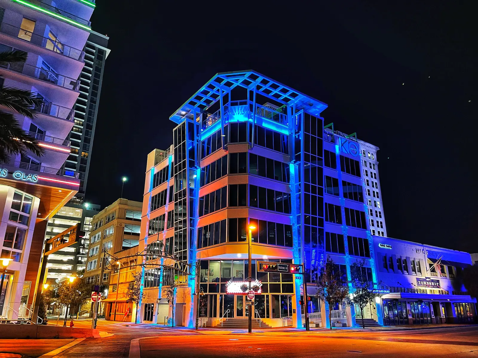 Andrews Avenue at Las Olas Boulevard in downtown Fort Lauderdale at night, near the Riverwalk.